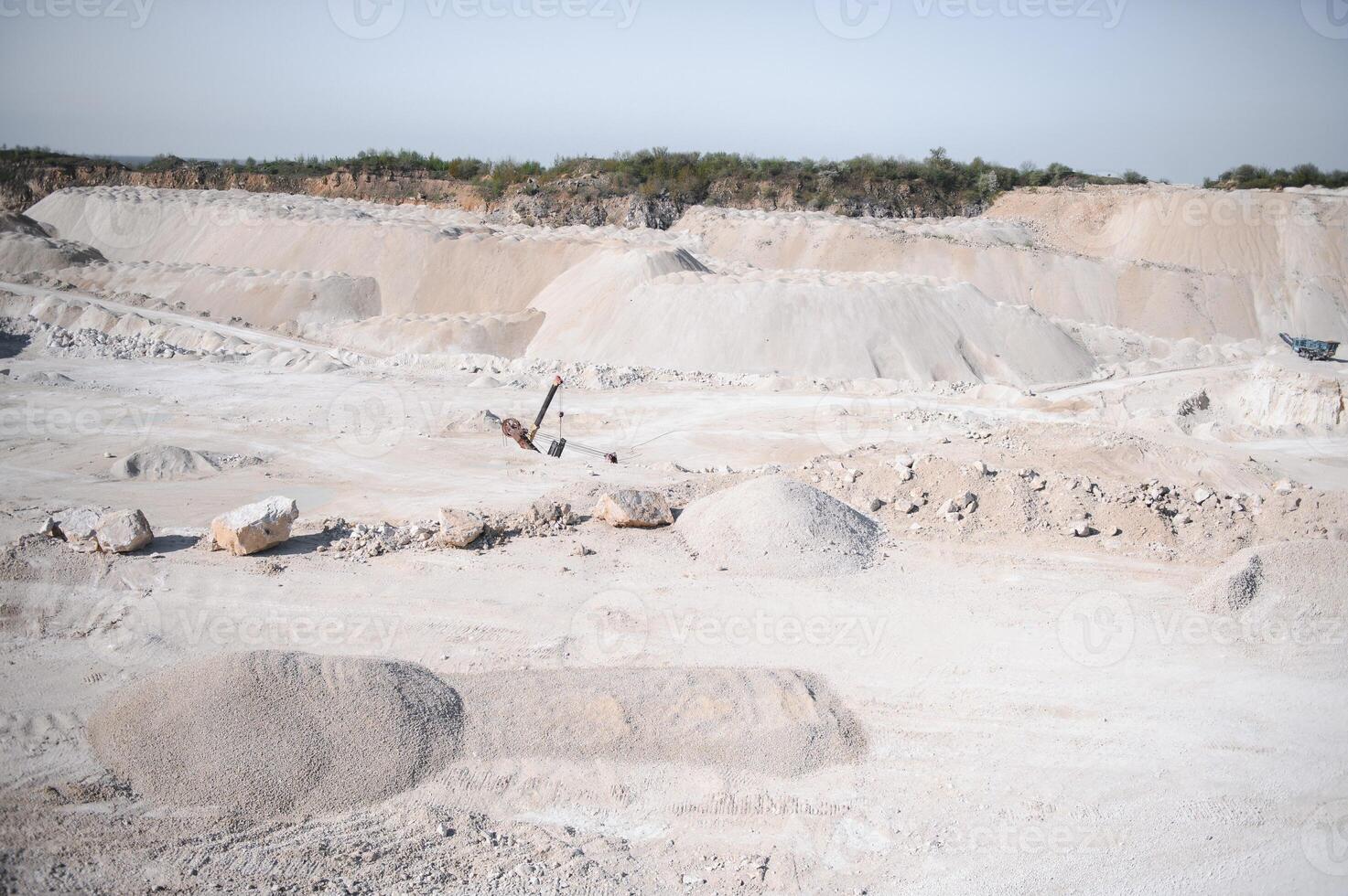 sand quarry, in the photo, a quarry for the extraction of sand against a blue sky photo