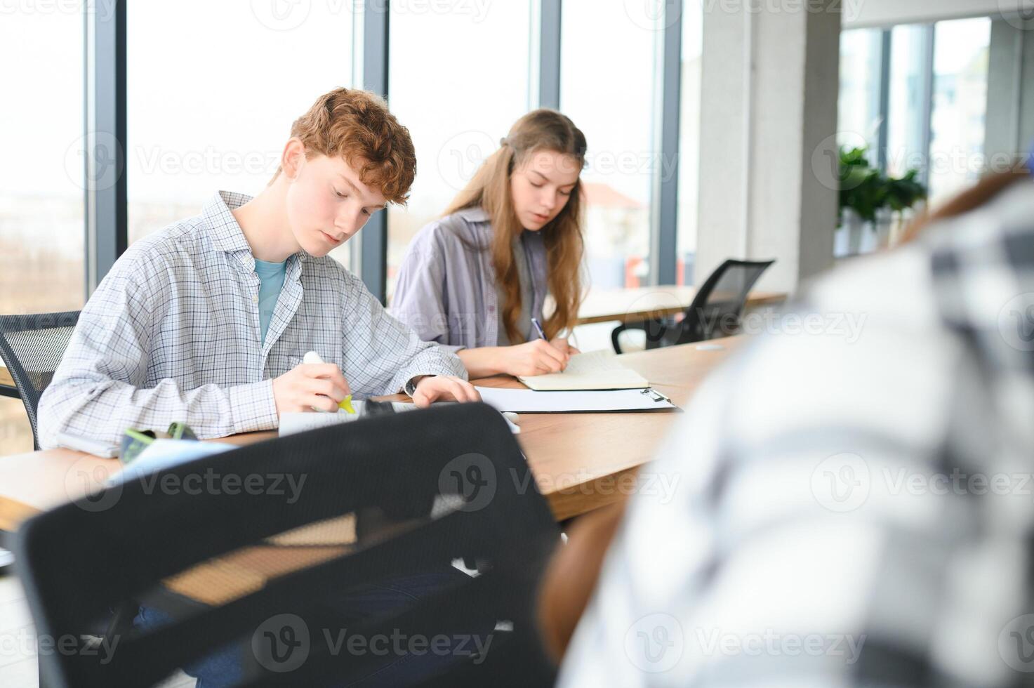 Students studying in library or classroom photo