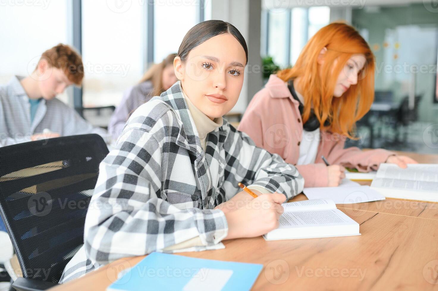 Students studying in library or classroom photo