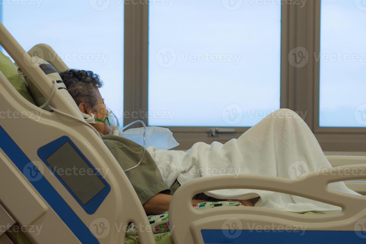 Close-up of elderly woman patients with lung disease, getting oxygen for treatment in the room at the hospital. Space for text. Concept of aged people and healthcare photo