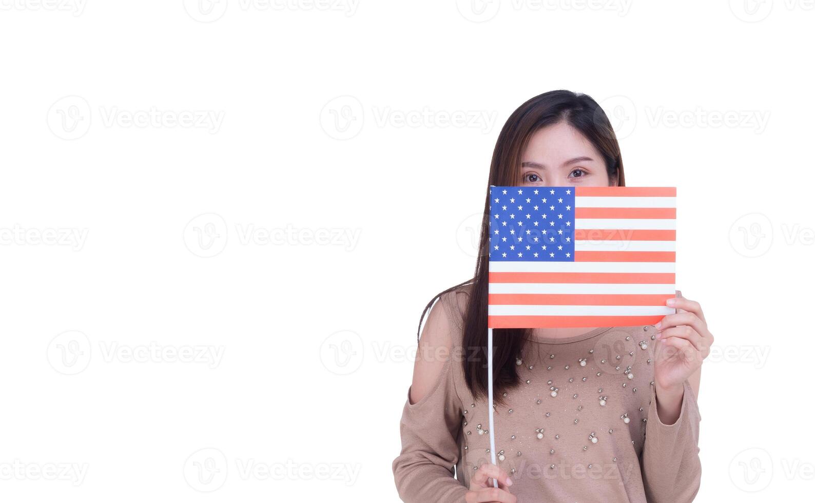 Young woman holding the USA flag off half face with white background. Space for Text. 4th of July. Celebrate American National Day. Labor Day. Independence Day photo