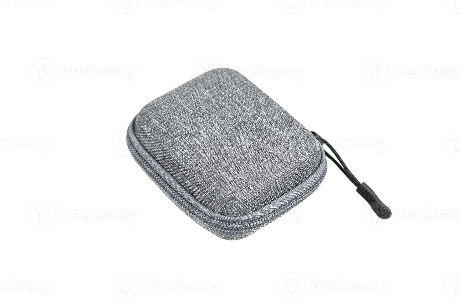 Protective hard case with a zipper and a gray fabric texture. Isolate on a white back photo