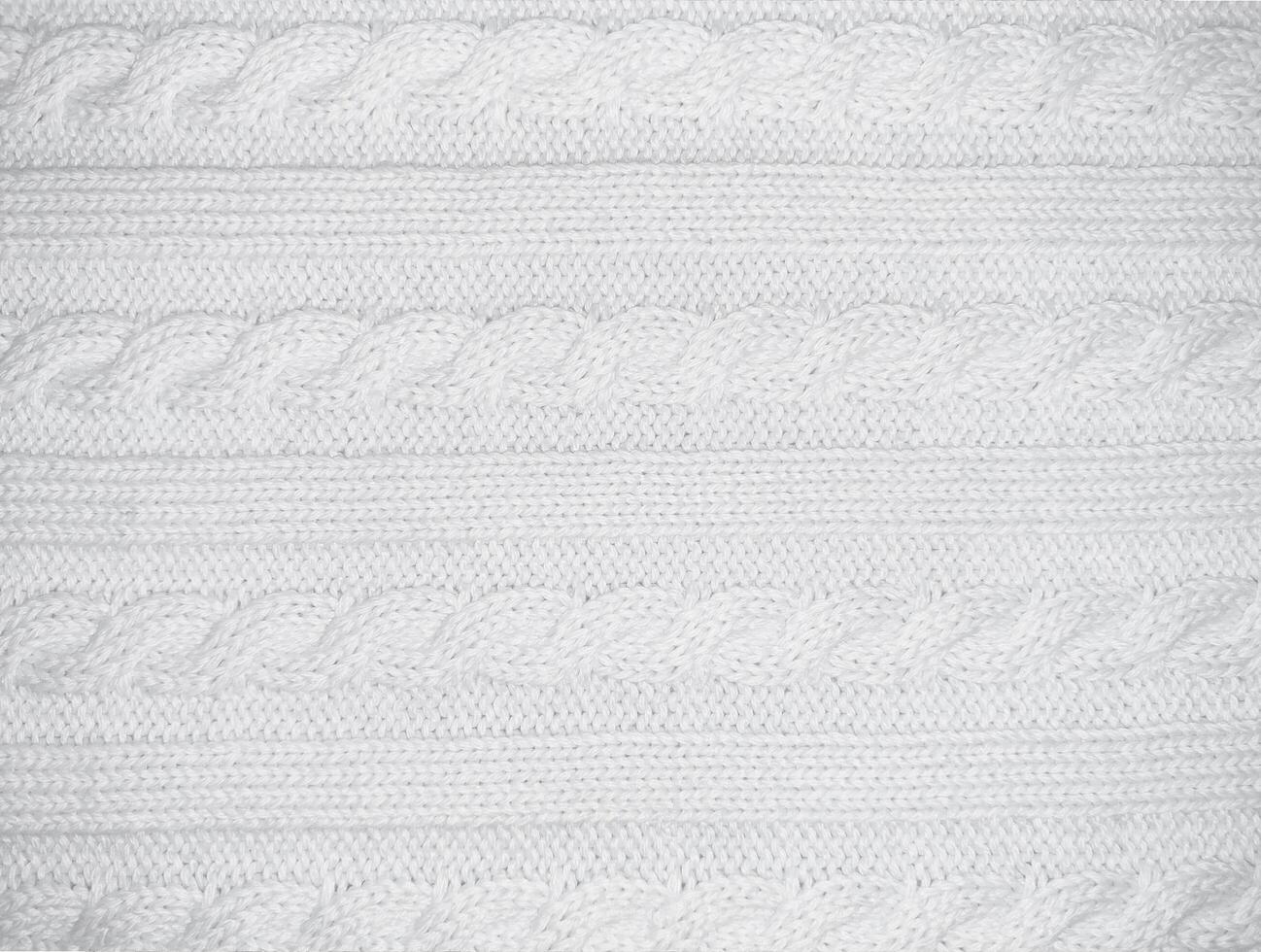 White background horizontal with texture of knitted pattern with pigtail photo