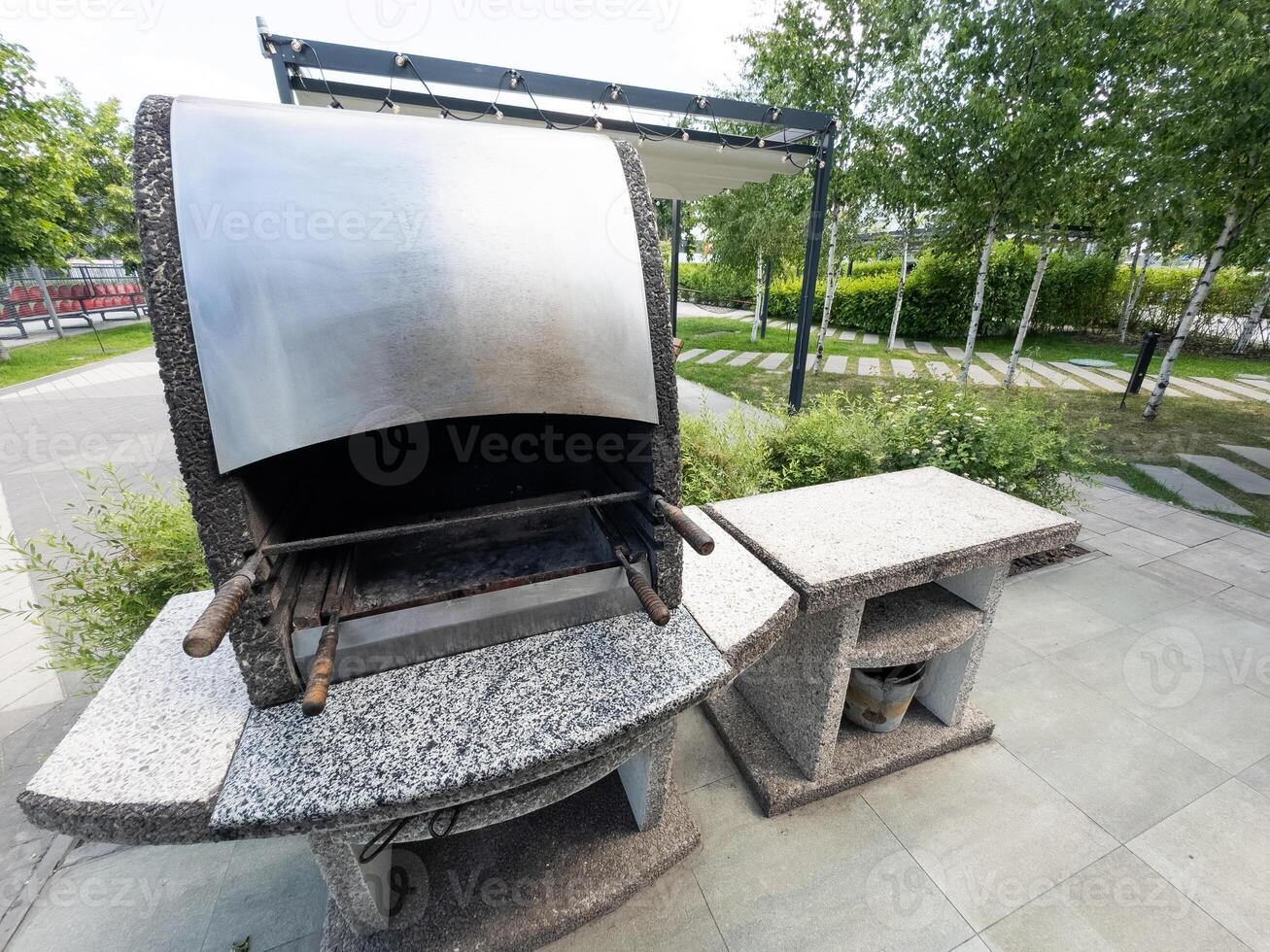 Outdoor BBQ grill. Barbecue open fireplace for cooking photo