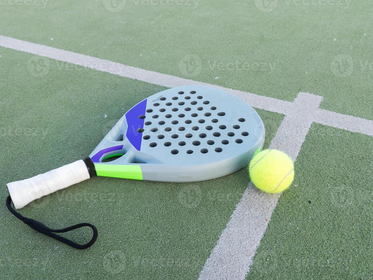 Paddle tennis racket and ball photo