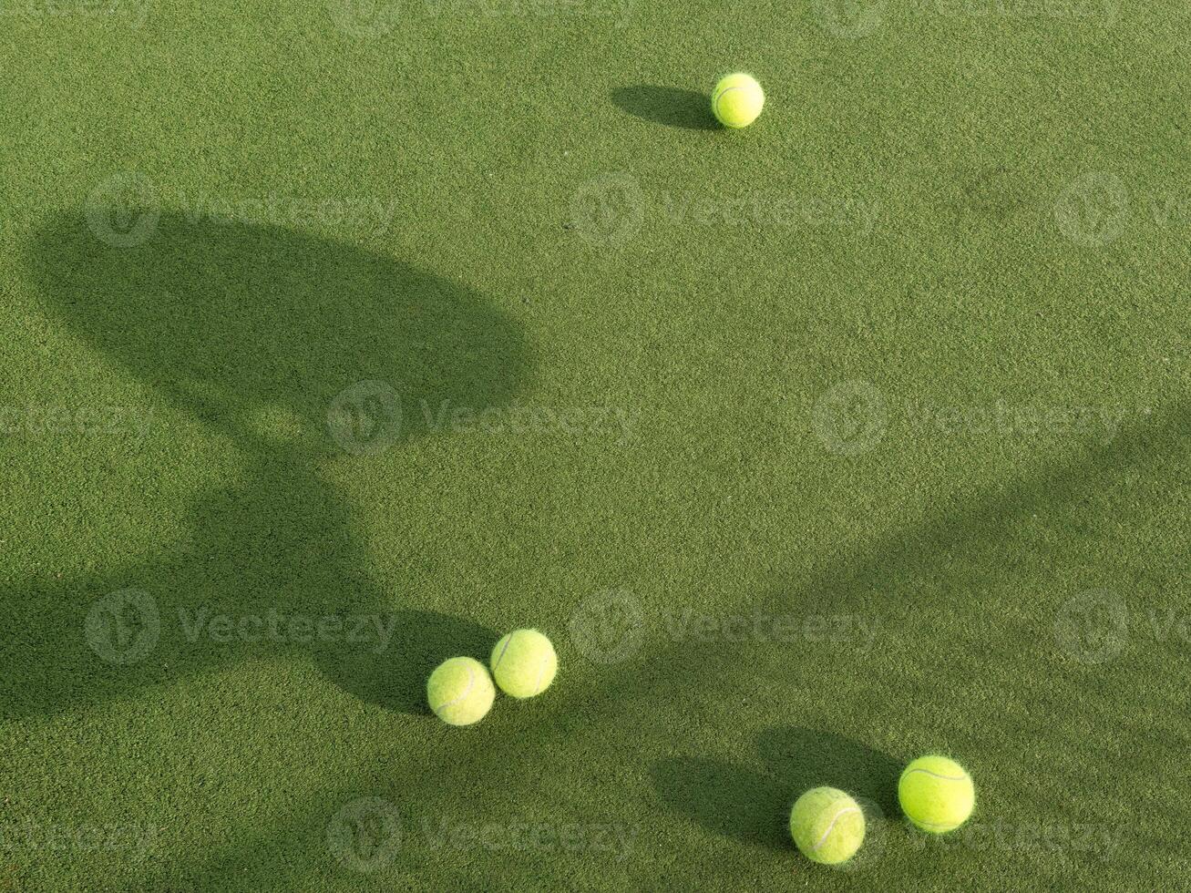 Paddle tennis racket shadow and ball on turf. Outdoors image with racket shadow photo