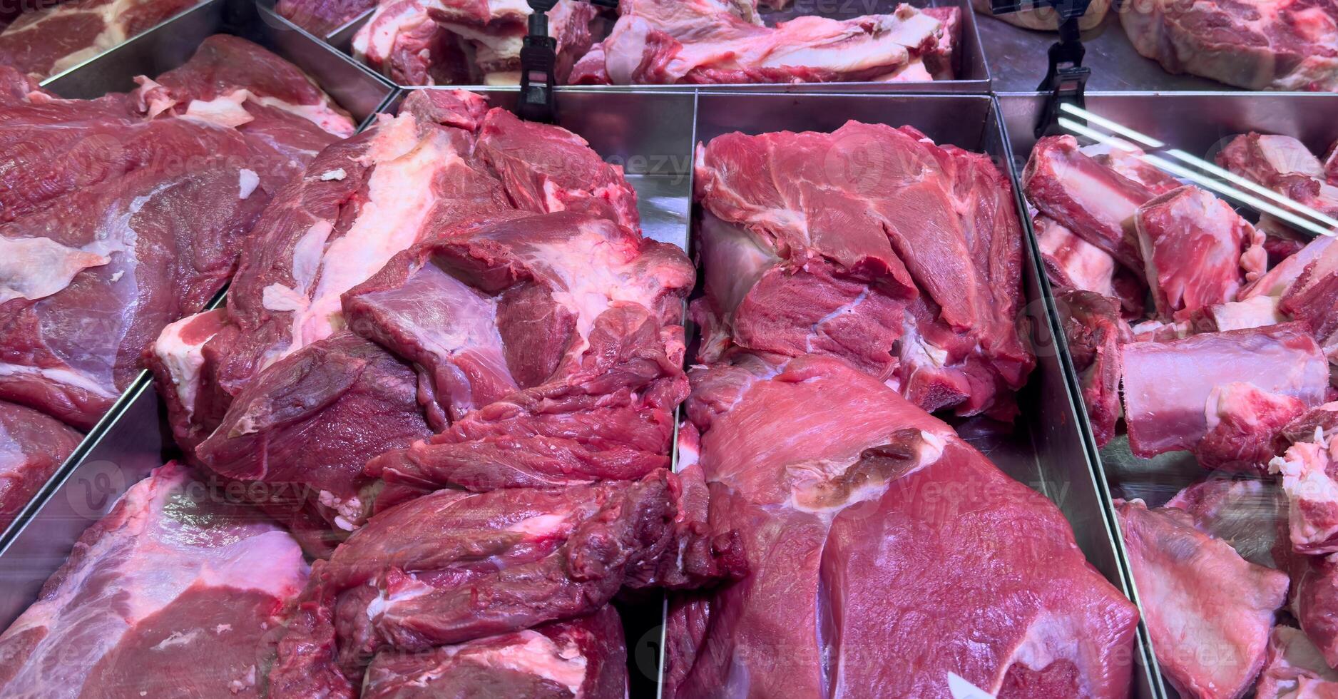 Meat in the store. Counter with beef, pork, chicken in the refrigerator of the supermarket. Fresh meat on sale photo
