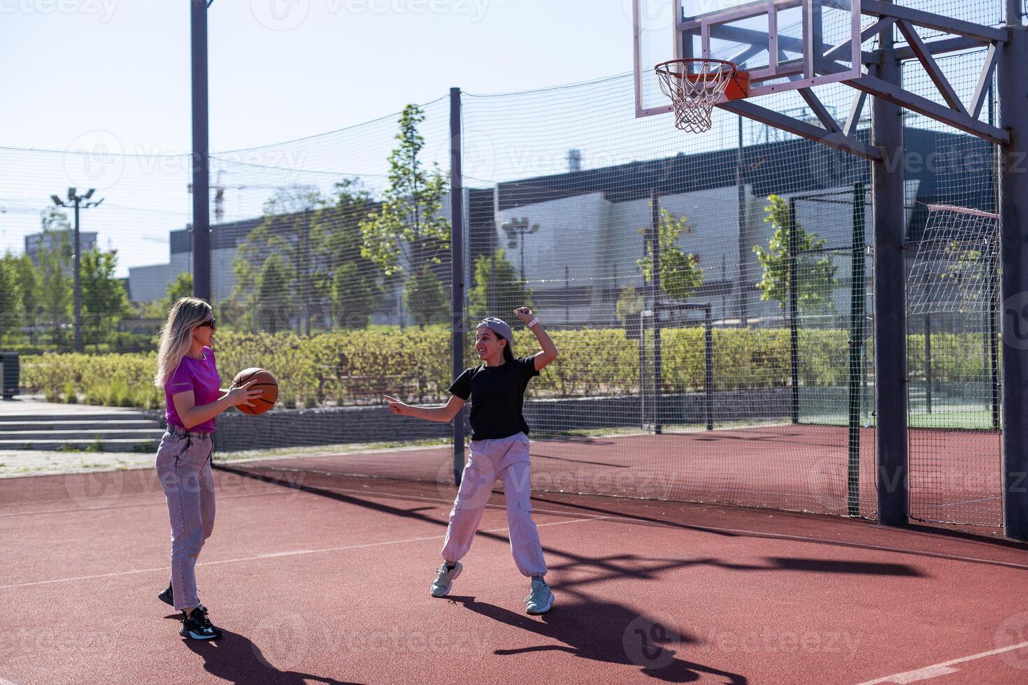 Mother and daughter playing basketball. photo