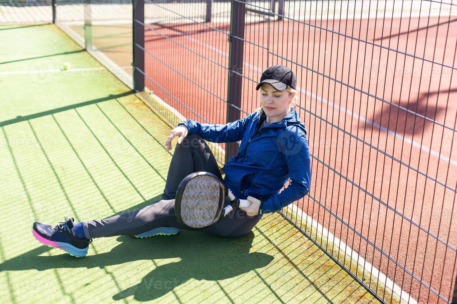 One women playing Paddle tennis photo