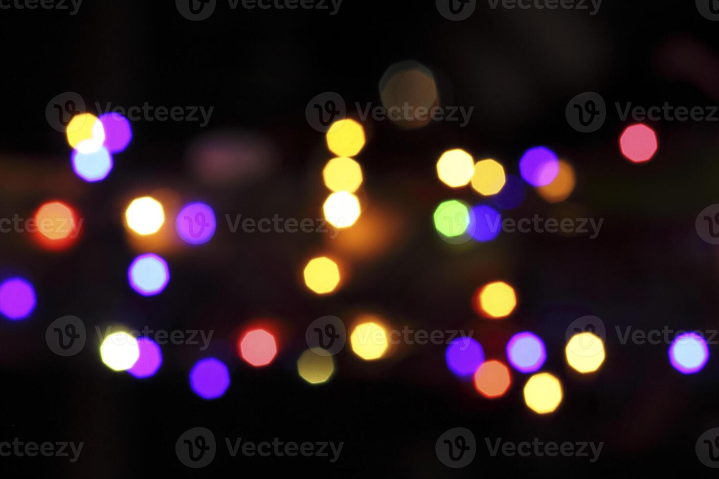 colorful and defocused lights on black background photo
