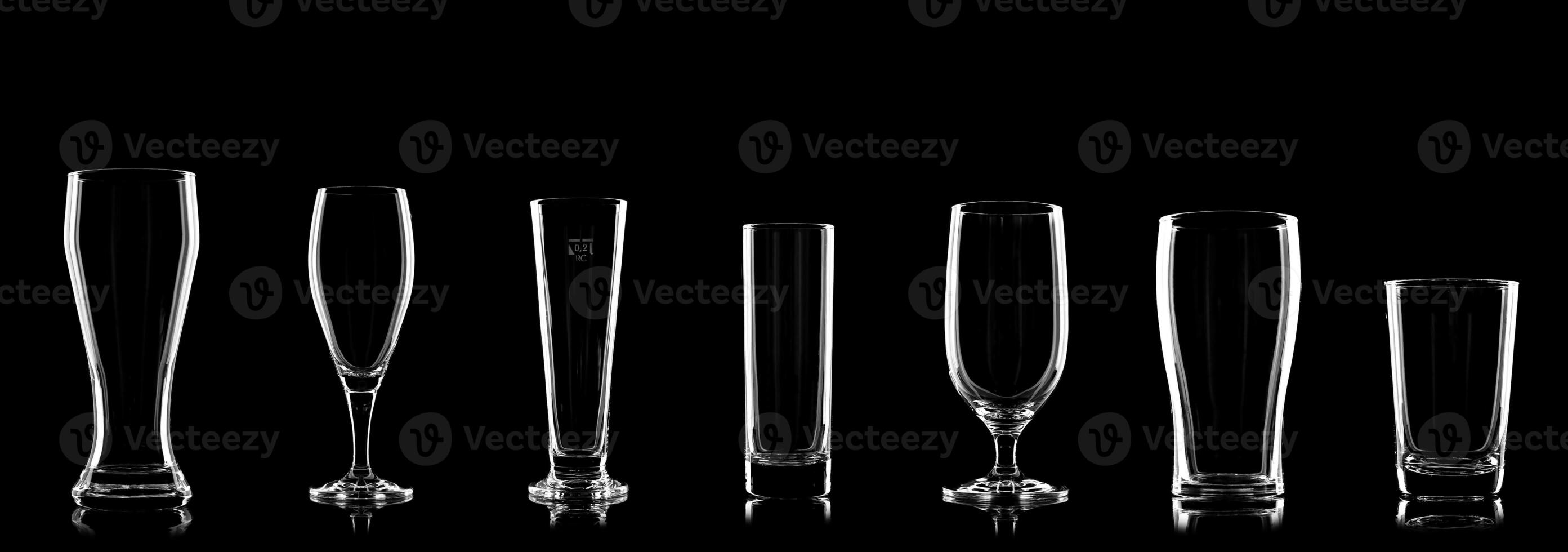 specific beer glasses lined up on black background for comparison photo