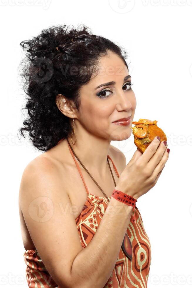 beautiful brazilian brunette with her acaraje on different backgrounds photo