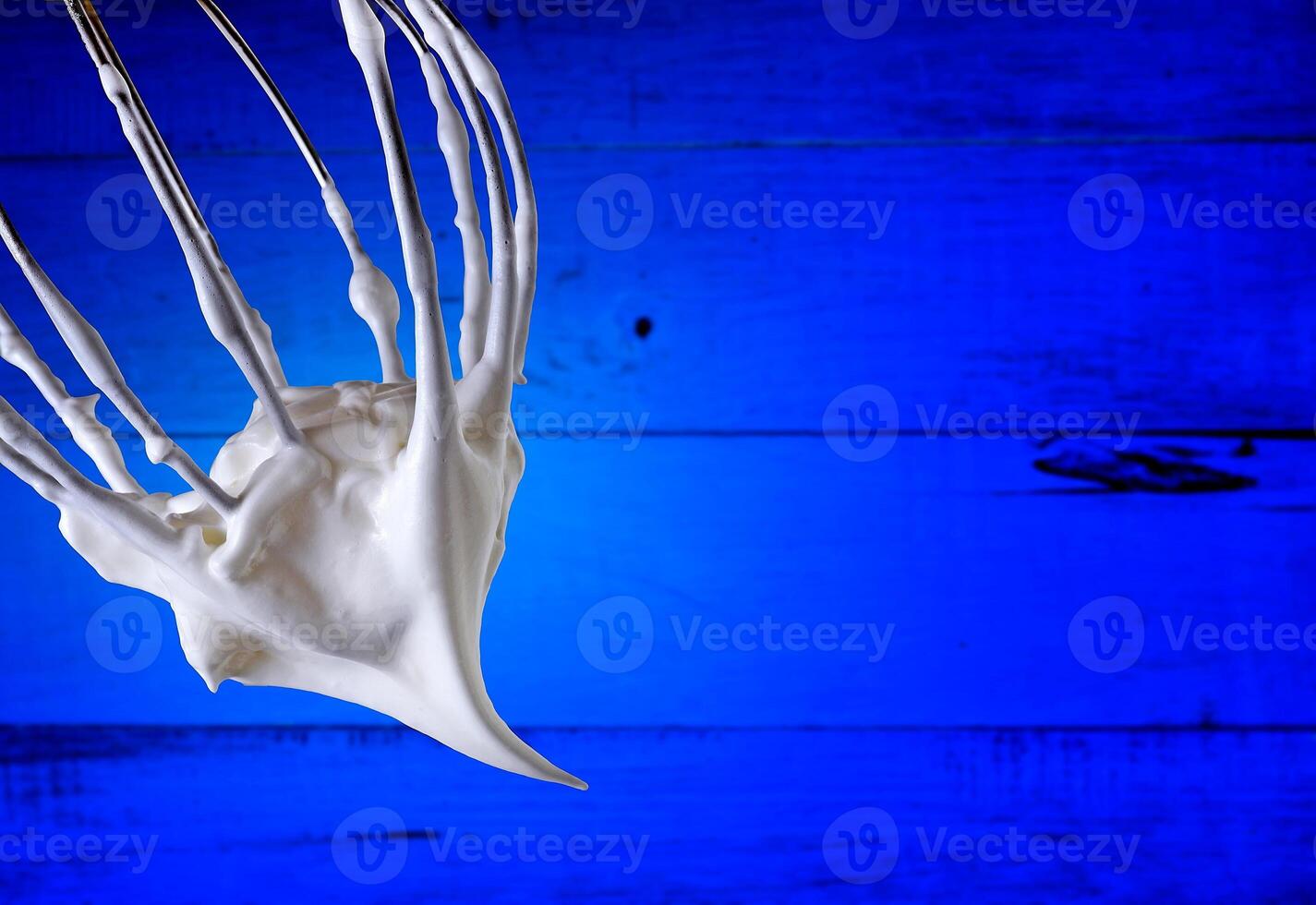 Fue with whipped cream on colored background photo