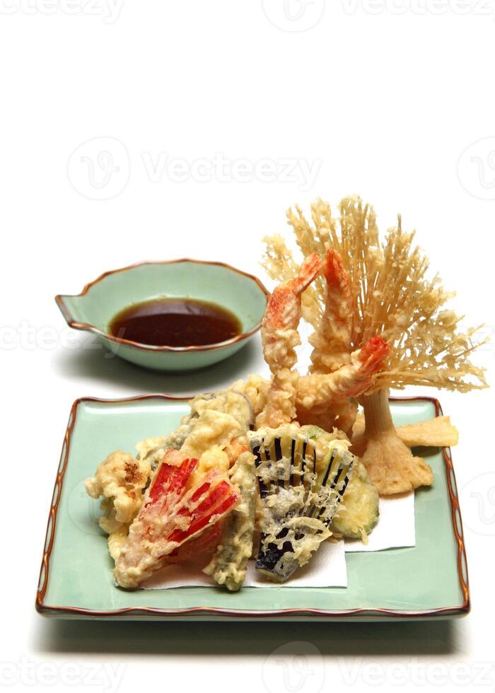 Shrimp and vegetable tempura, typical Japanese dish with breaded and fried shrimp and vegetables photo