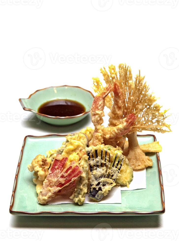 Shrimp and vegetable tempura, typical Japanese dish with breaded and fried shrimp and vegetables photo