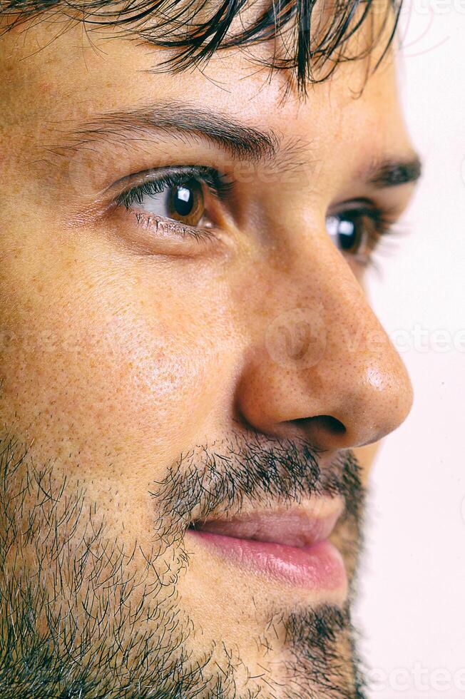 young man with beard in different situations on neutral background photo