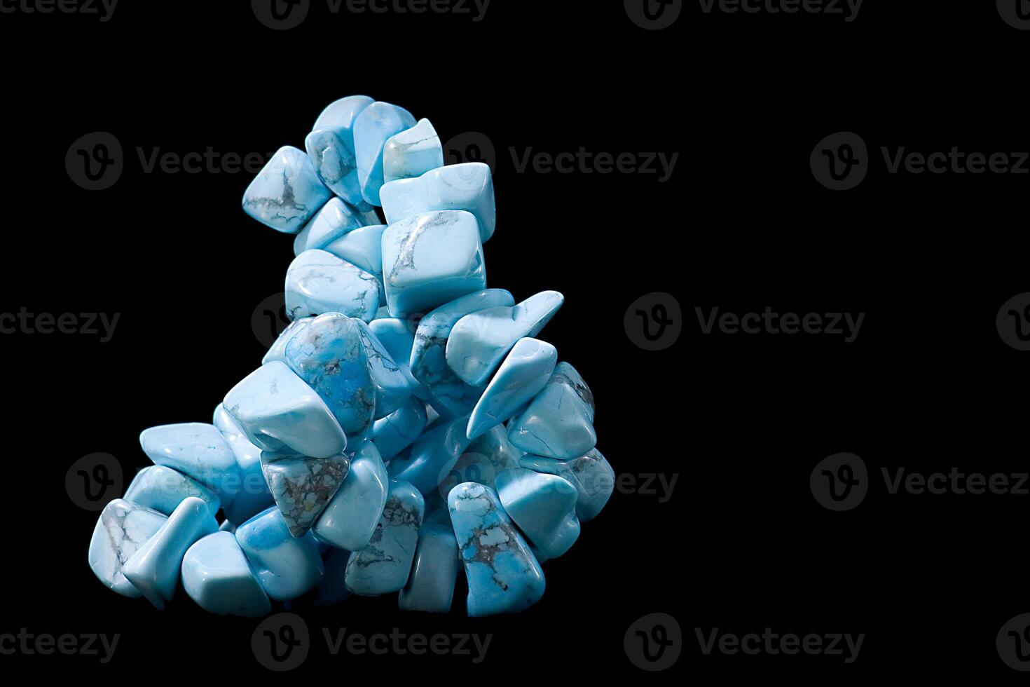 cut and rough precious stones on a black background photo