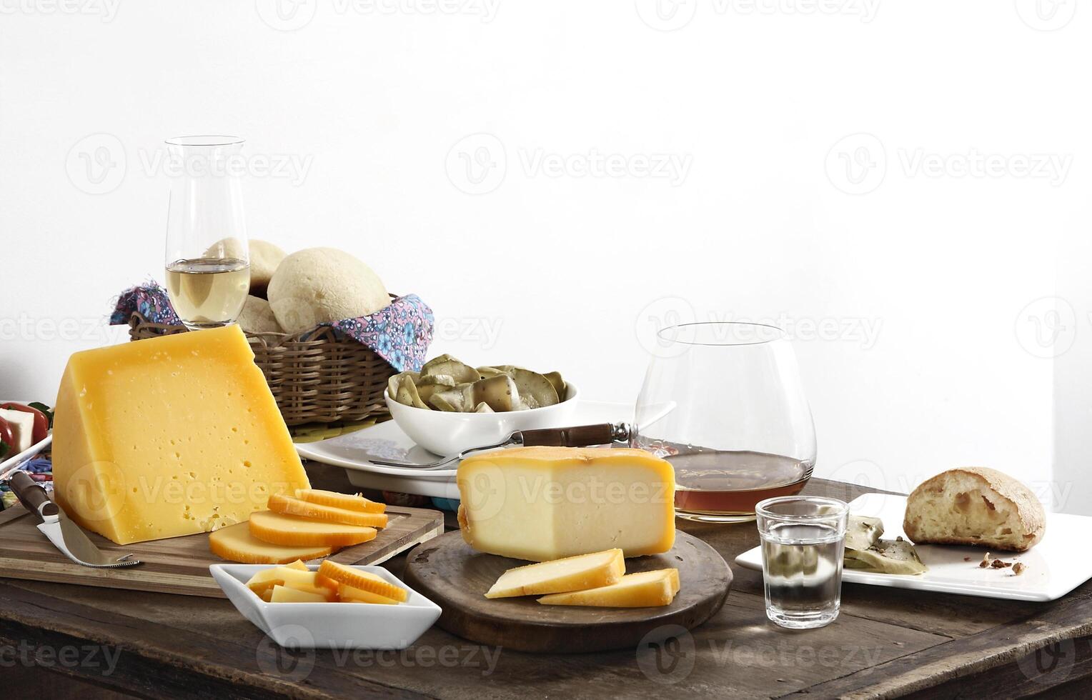 wooden table with snacks, fruits and cheeses to be tasted with pinga, the famous Brazilian brandy photo