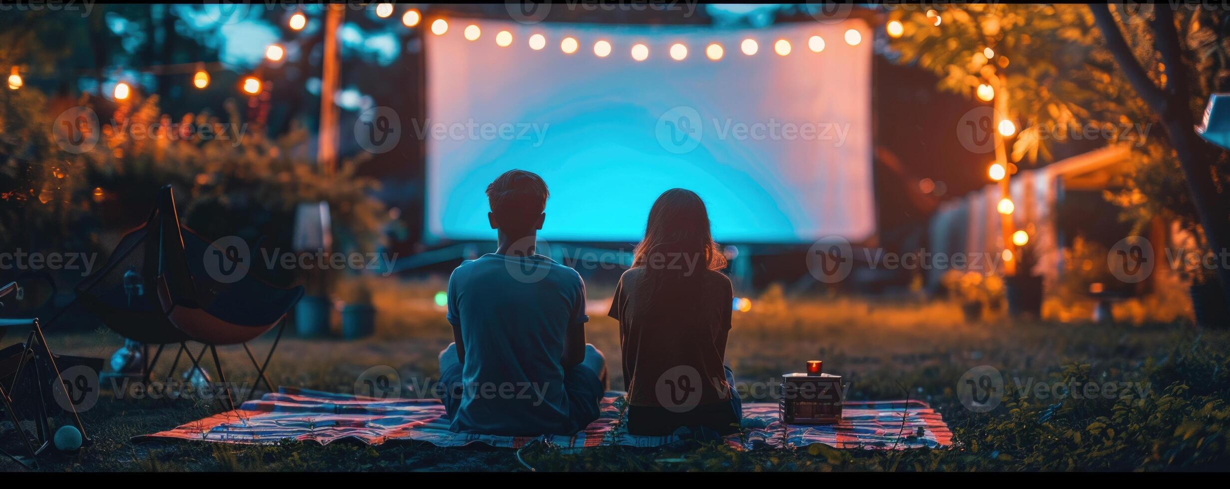 blank white screen outdoors in green grass park. outdoor cinema, big screen show. photo