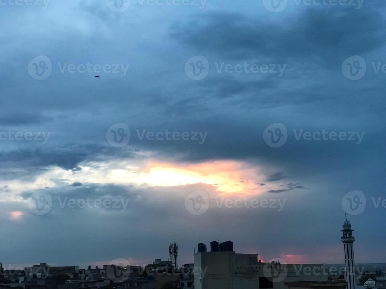 a view of the sunset from the roof of a building photo