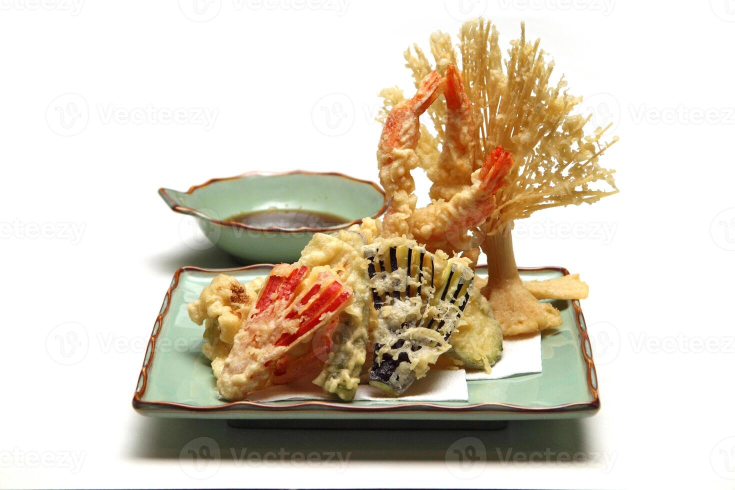 Shrimp and vegetable tempura, typical Japanese dish with breaded and fried shrimp and vegetables photo