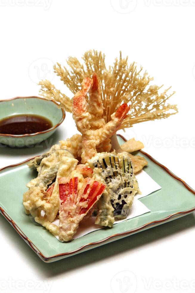 Shrimp and vegetable tempura, typical Japanese dish with breaded and fried shrimp and vegetables photo