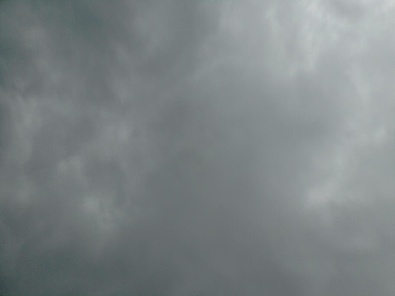 Gloomy overcast moody cloudy sky background photo