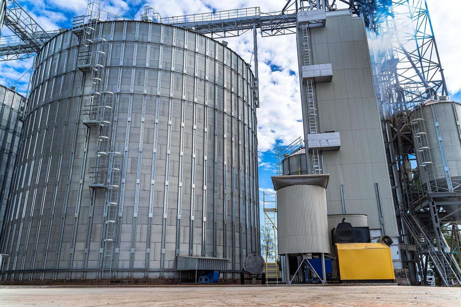 Modern up to date factory. Industrial agriculture elevators with harvested grain. Grain cooperative. Selective focus. photo