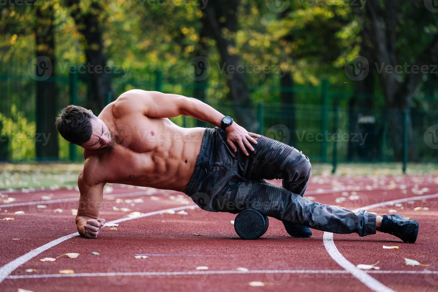Outdoor training concept. Motivated muscular athletic male. photo