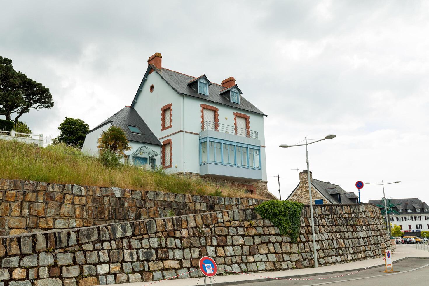 Rural two storey house exteriour, summer outdoors Motgat, France, 29 May 2018 photo