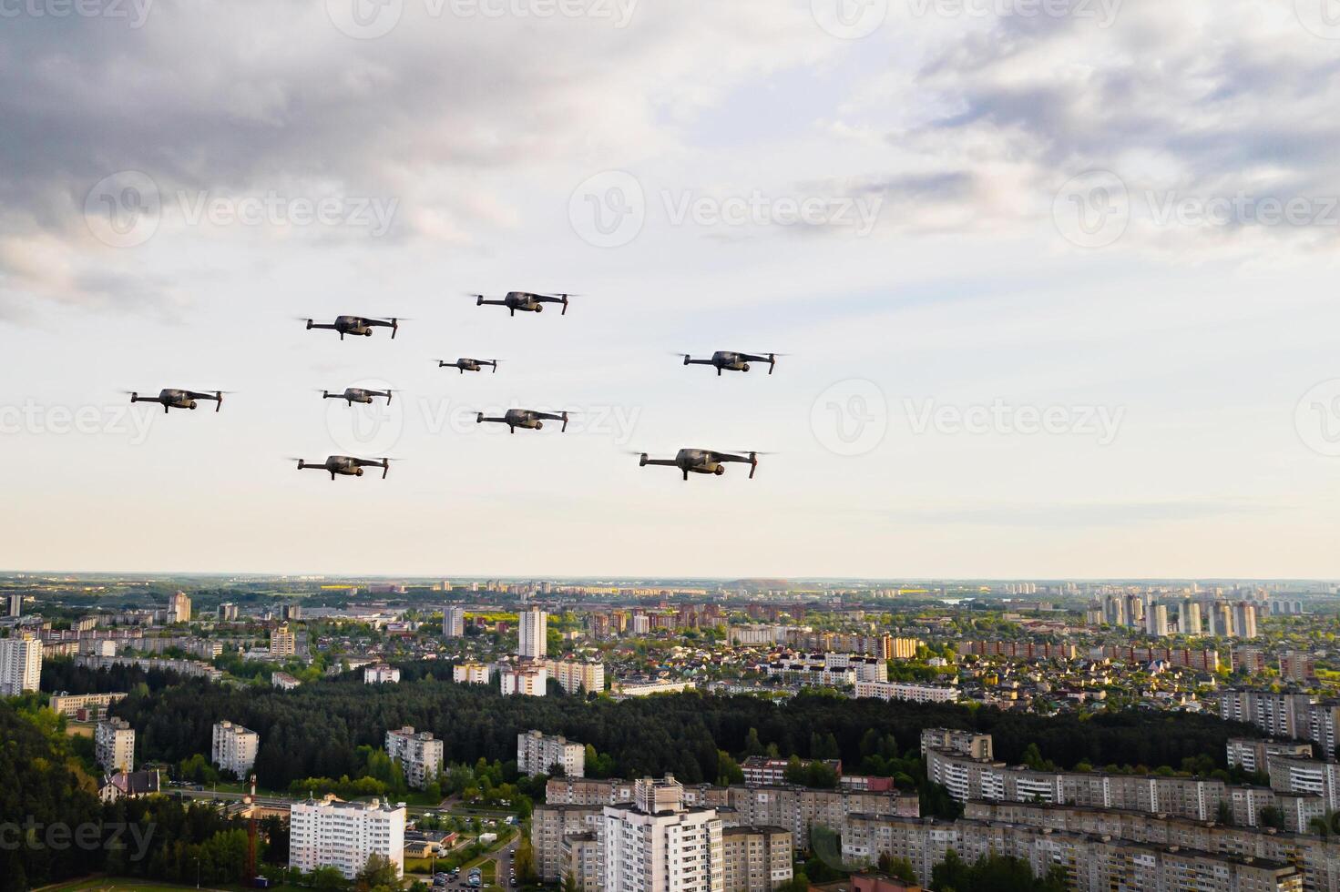 Drones fly over the city's houses. Urban landscape with drones flying over it, quadrocopters flying over the city. photo