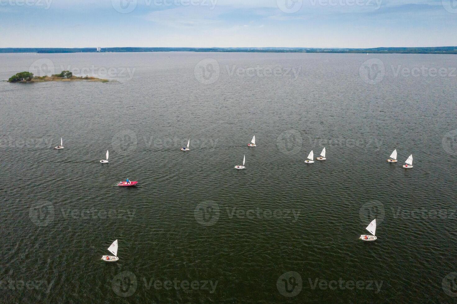 Sailing regatta on the sea. many white sails float on the water photo