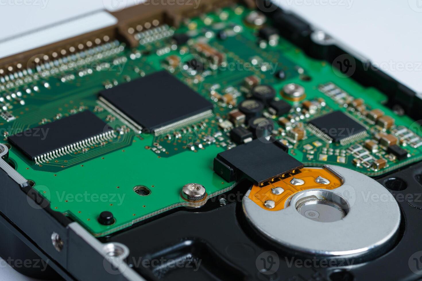 View of the printed circuit board of a computer hard drive. photo
