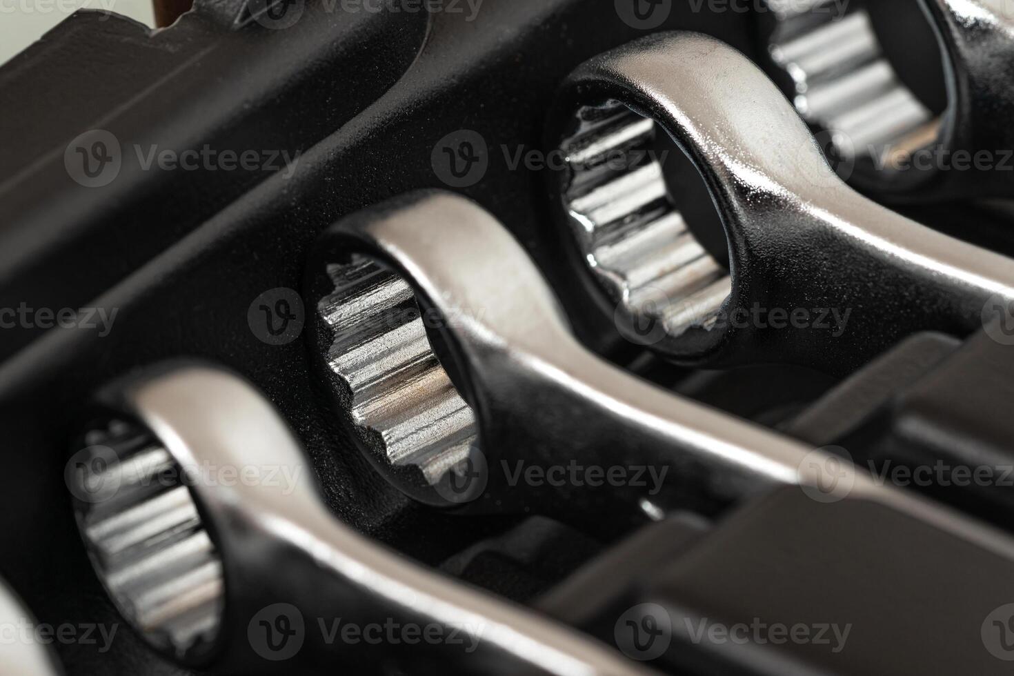 Ring wrenches in a row in a box for hand tools. photo