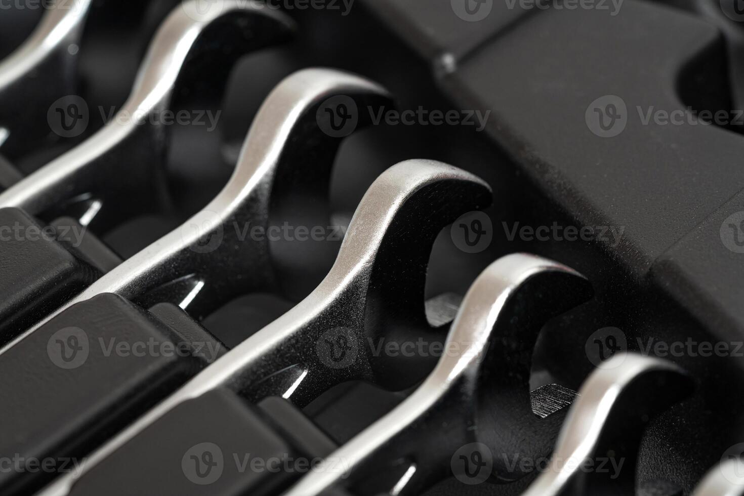 Wrenches lying in a row in a toolbox. photo