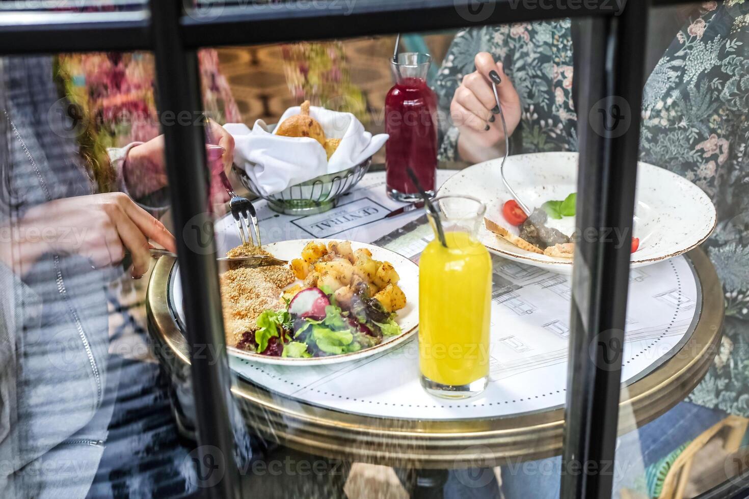 Person Sitting at Table With Plate of Food photo