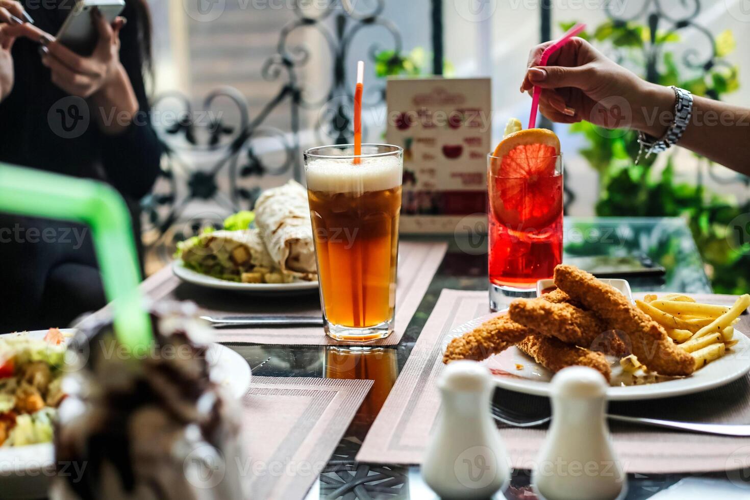 Group of People Enjoying a Meal Together at a Table photo