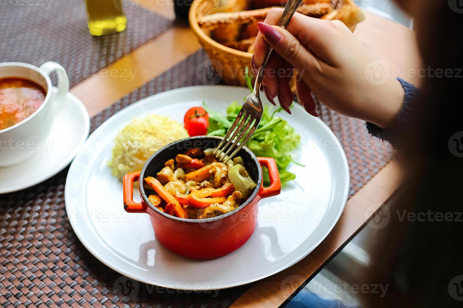 Person Enjoying a Meal, Using Fork photo