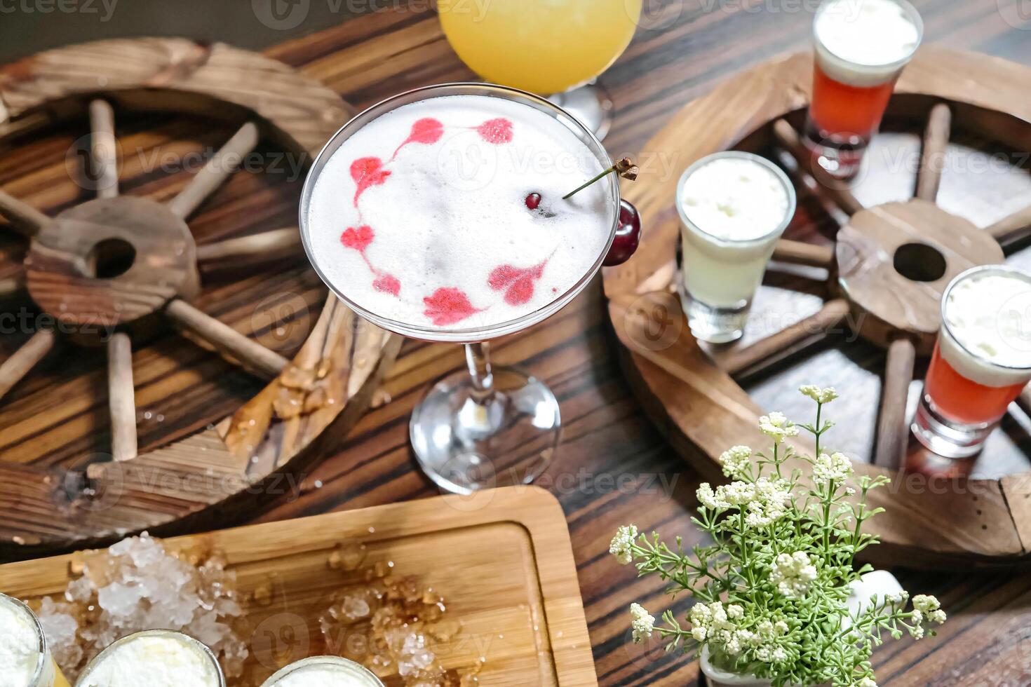 Wooden Tray With Refreshing Drinks Next to a Variety of Beverages photo
