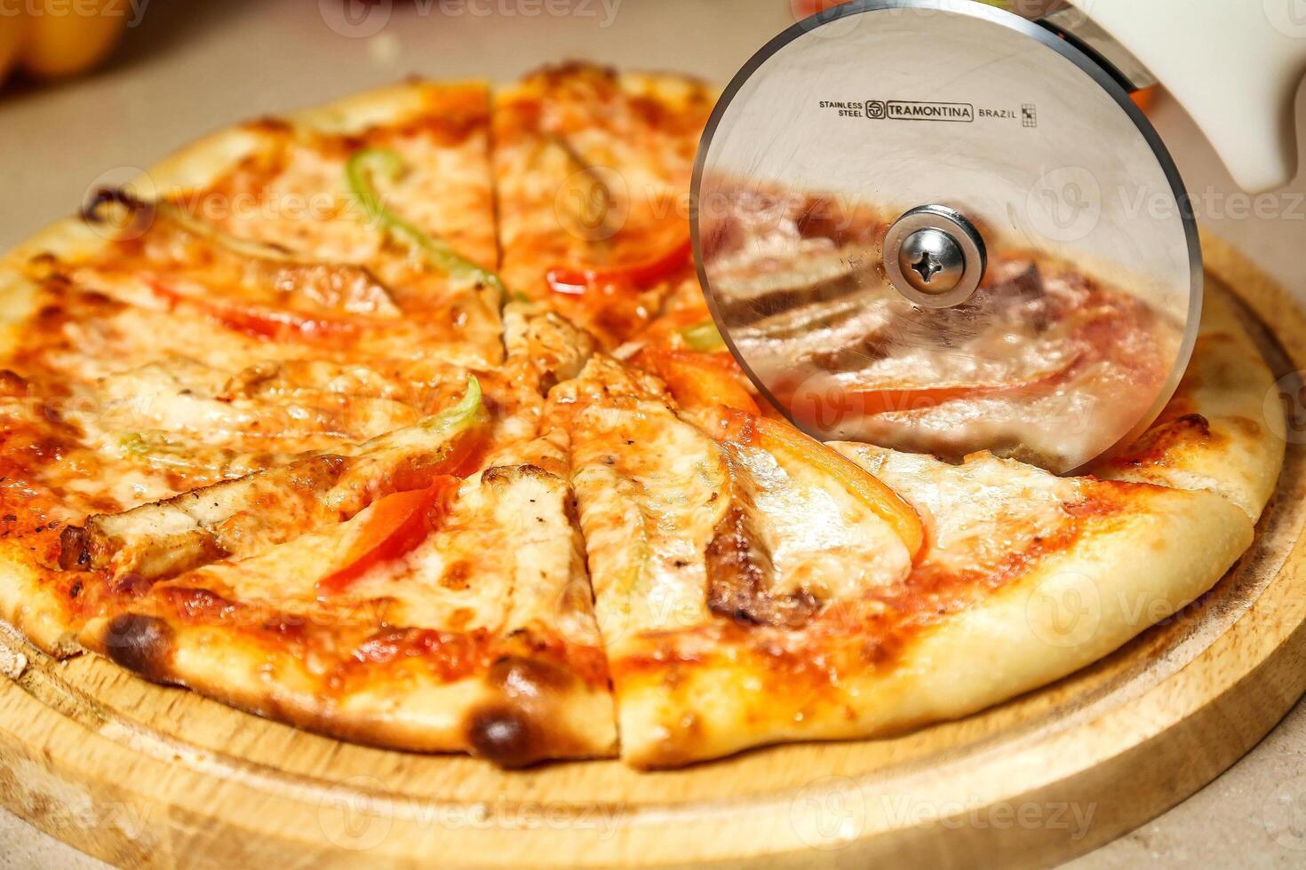 Pizza on Wooden Cutting Board photo