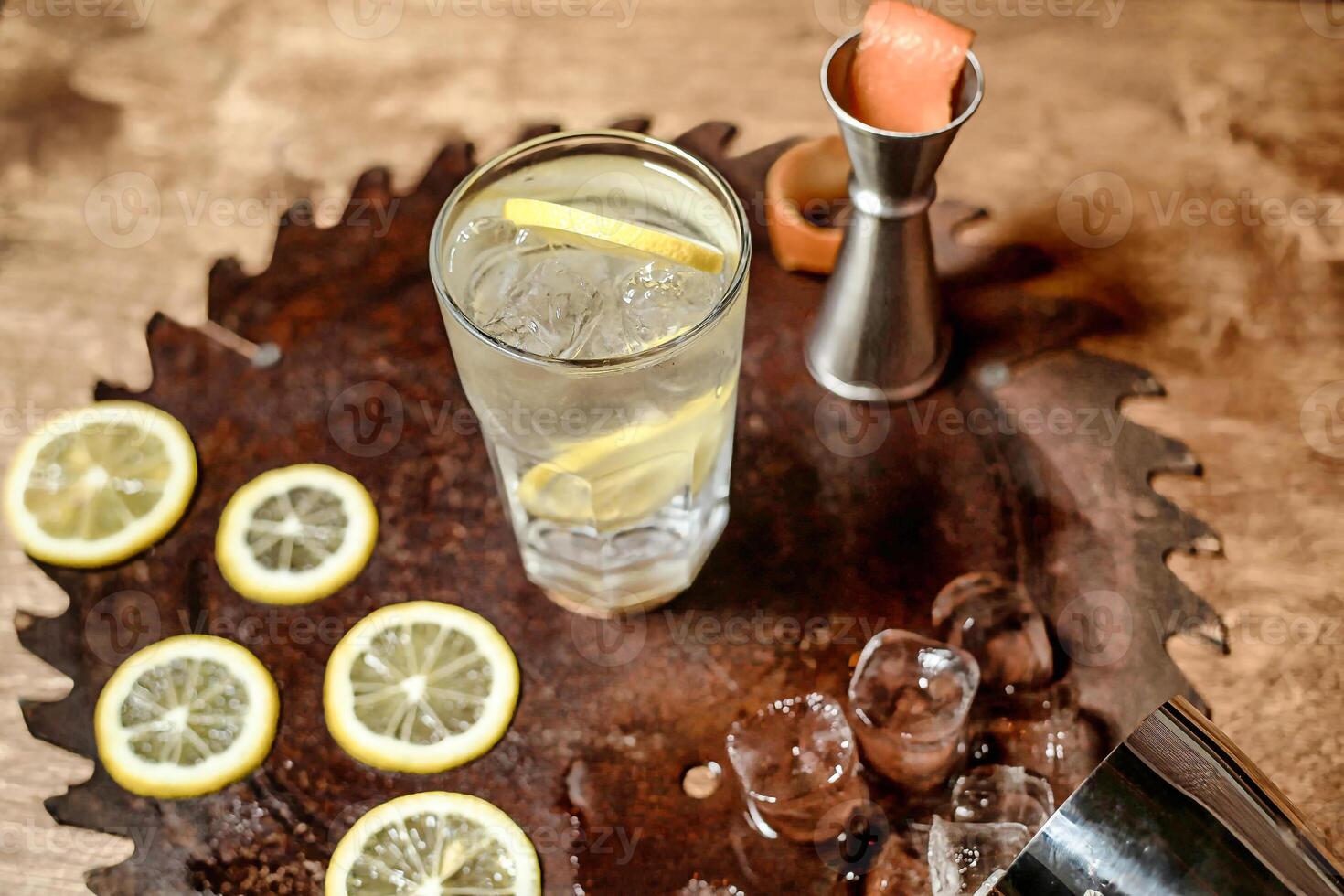 Refreshing Glass of Water With Sliced Lemons on a Tray photo