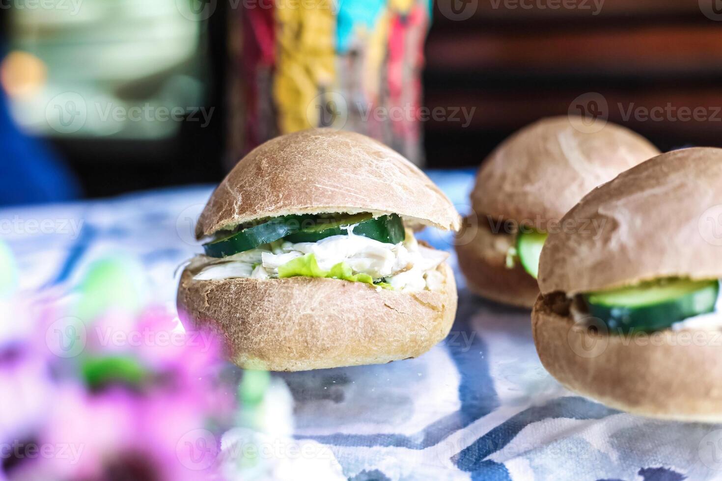 Close Up of Three Sandwiches on Table photo