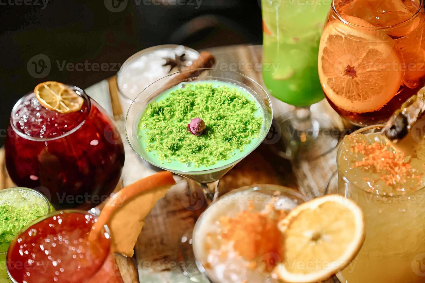 Table With Assorted Glasses Filled With Different Types of Drinks photo