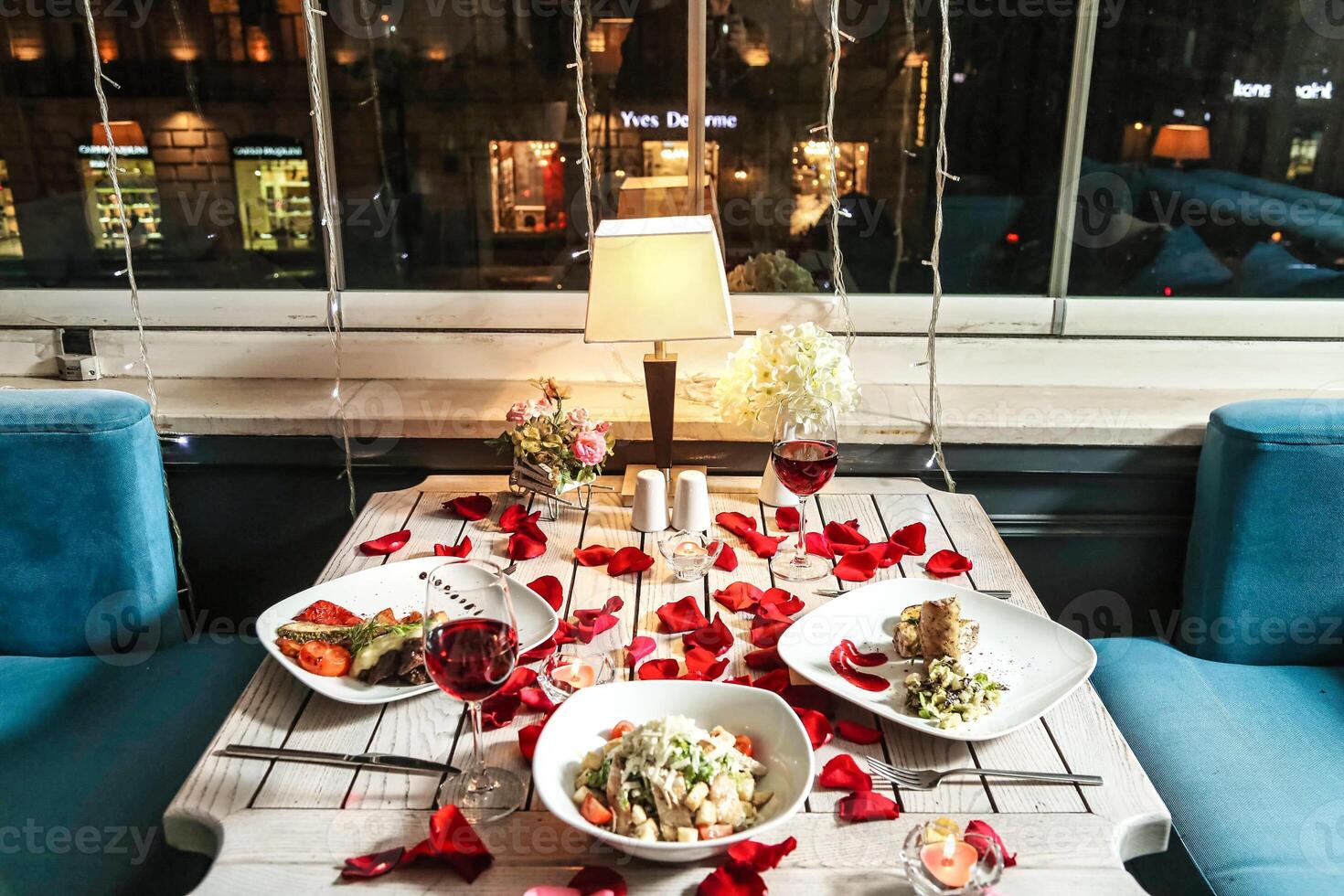 Table Set With Assorted Food Plates photo