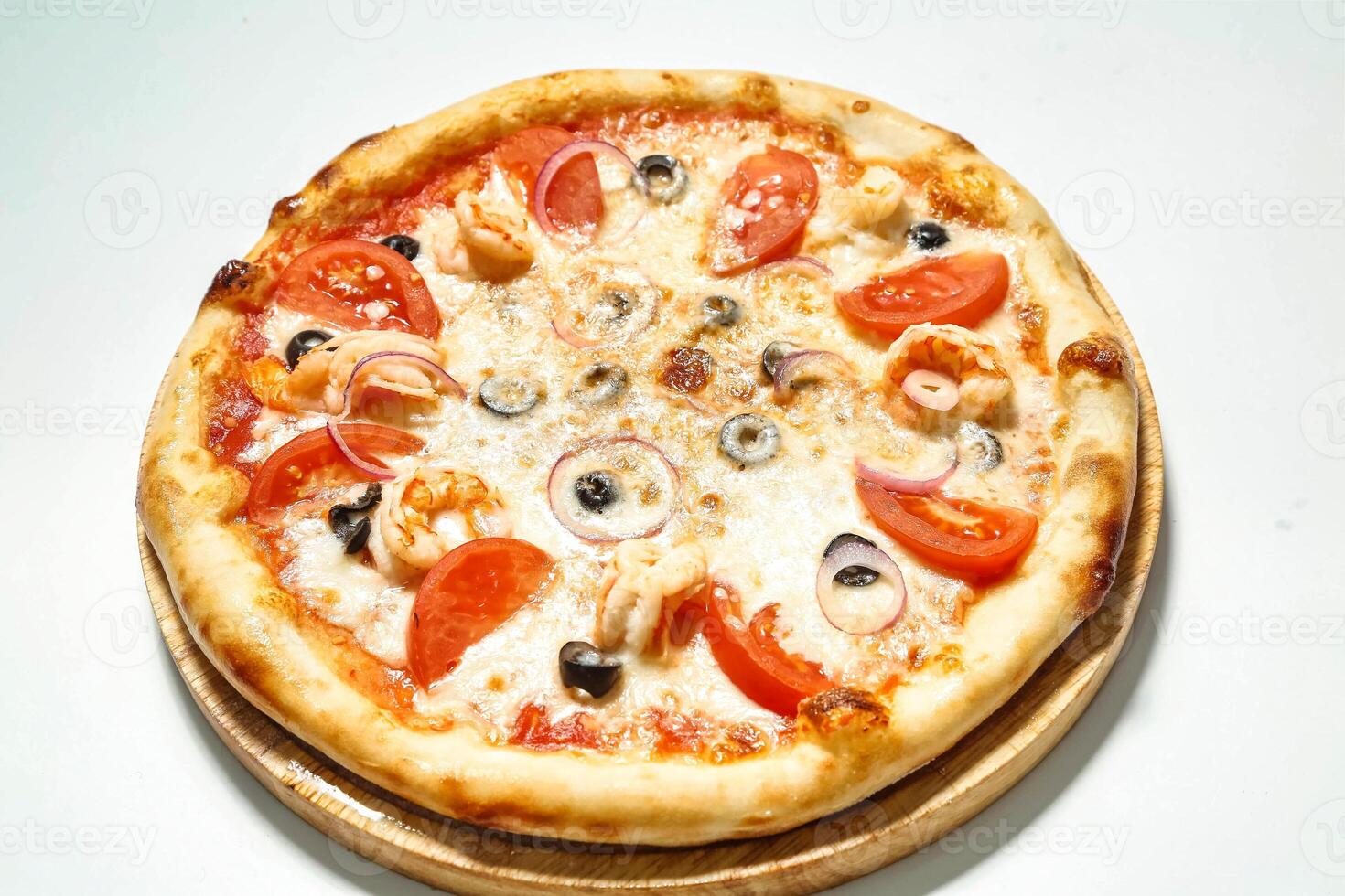 Delicious Pizza on Wooden Plate photo