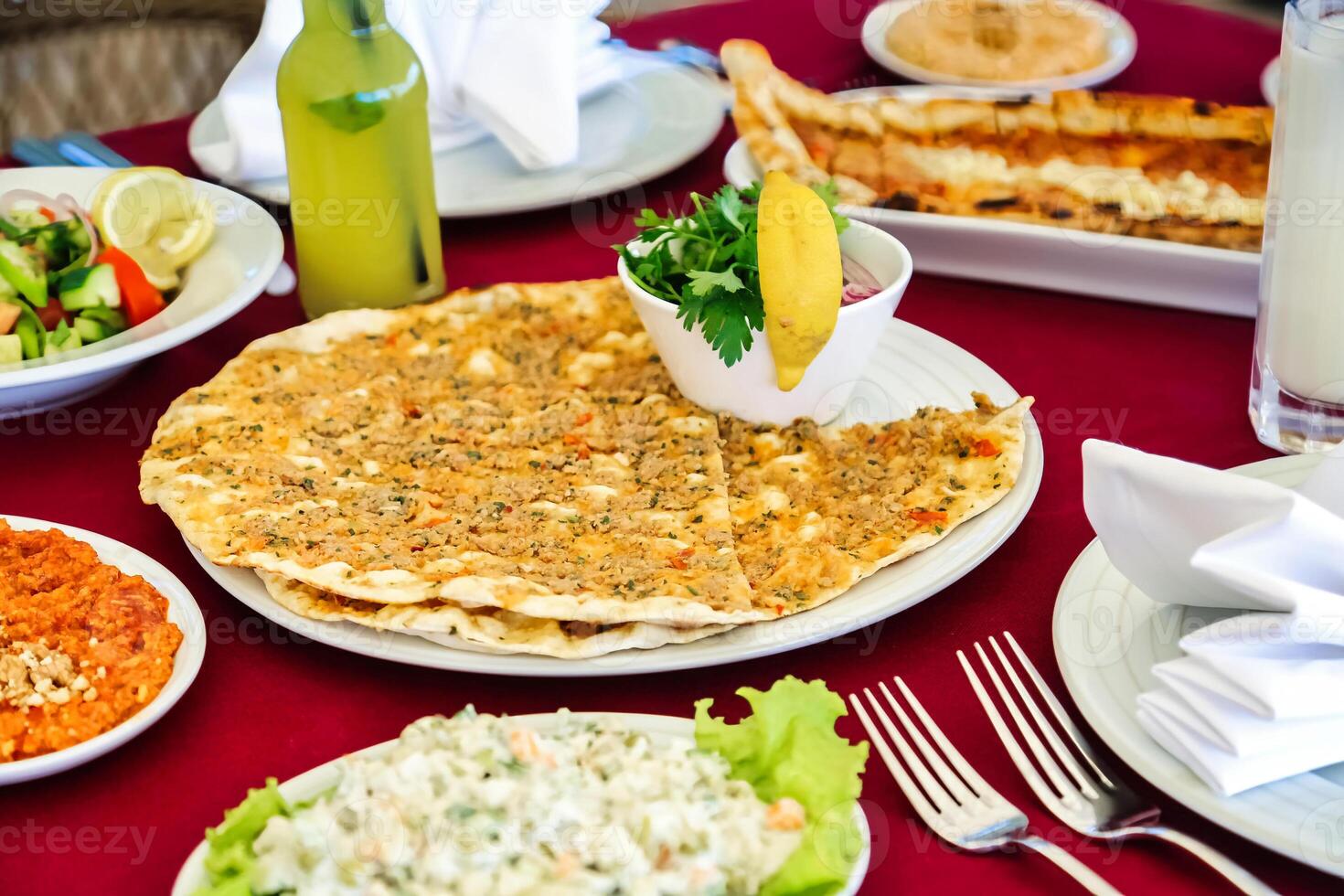 Red Table Adorned With Platters of Food photo