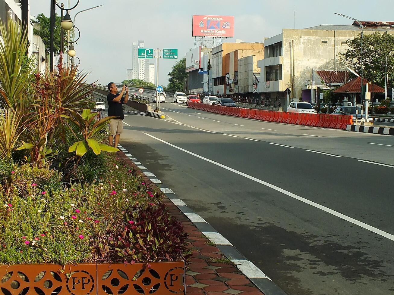 Surakarta, Central Java, Indonesia April 11, 2024. A sight seeing of Main Roads Slamet Riyadi Street in the morning. Not busy yet. People still preparing for their activity photo