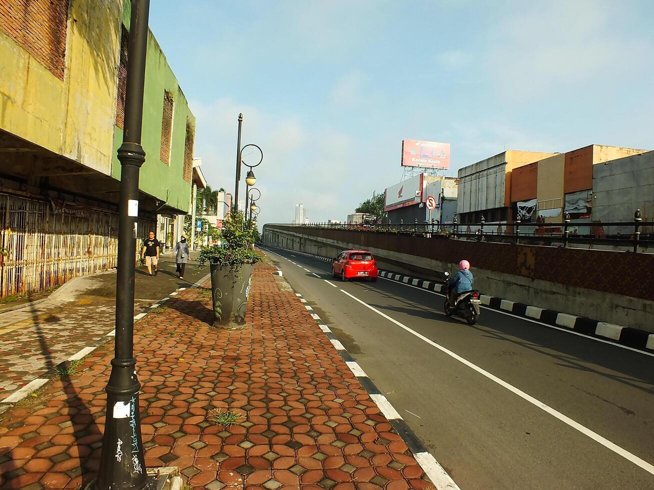 Surakarta, Central Java, Indonesia April 11, 2024. A sight seeing of Main Roads Slamet Riyadi Street in the morning. Not busy yet. People still preparing for their activity photo
