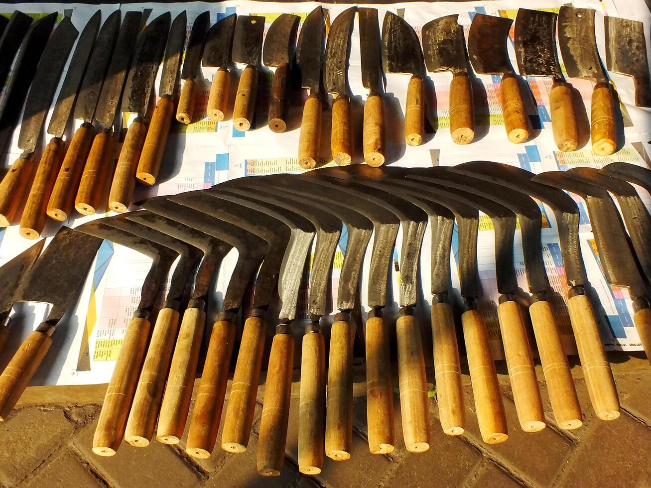 Various shapes of knives are sold in the market. Some of them is use by farmer on the field. This product handmane by blacksmith photo