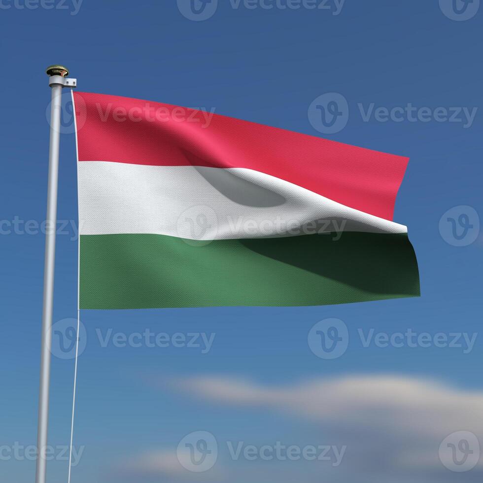 Hungary Flag is waving in front of a blue sky with blurred clouds in the background photo